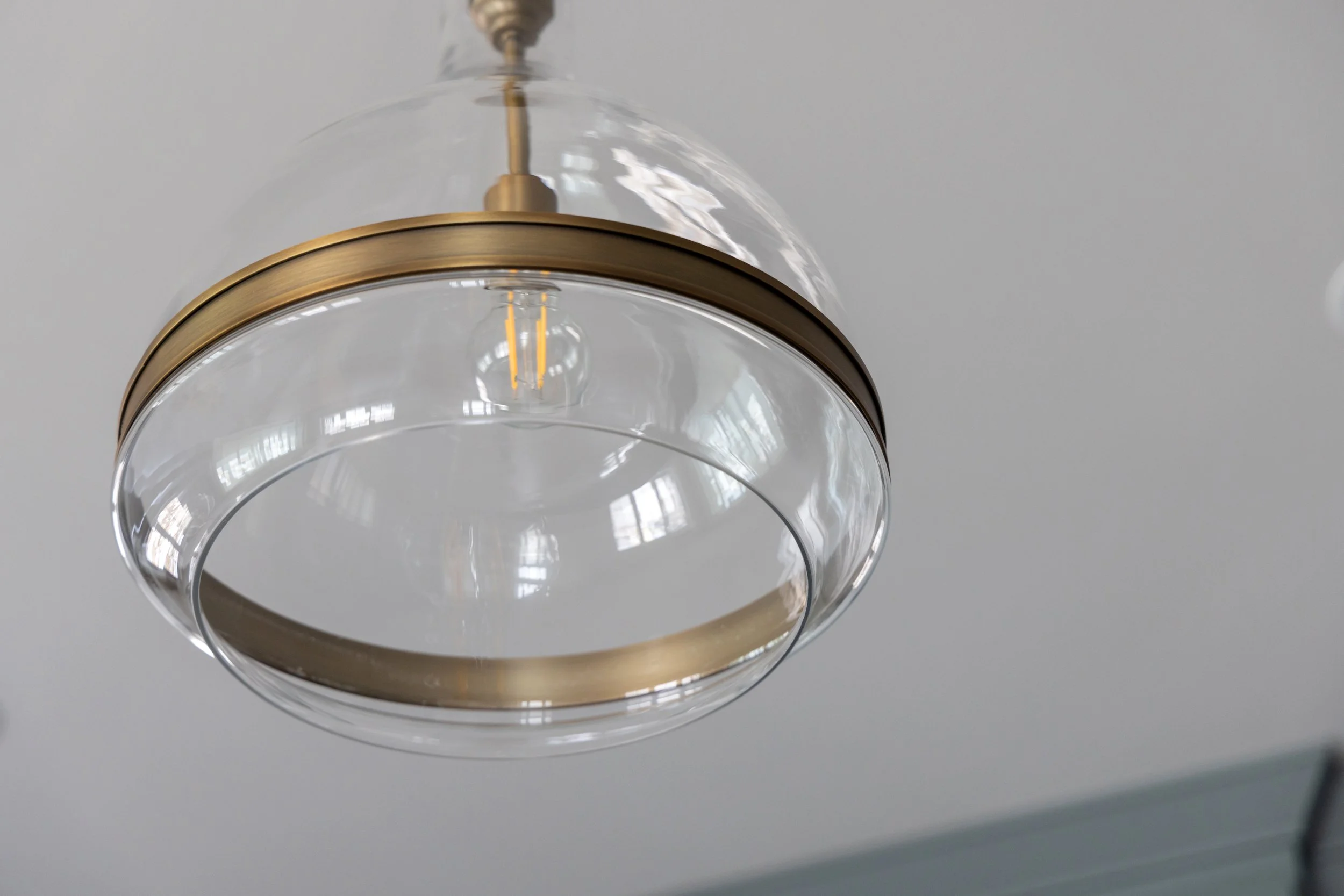 Glass and brass light fixture