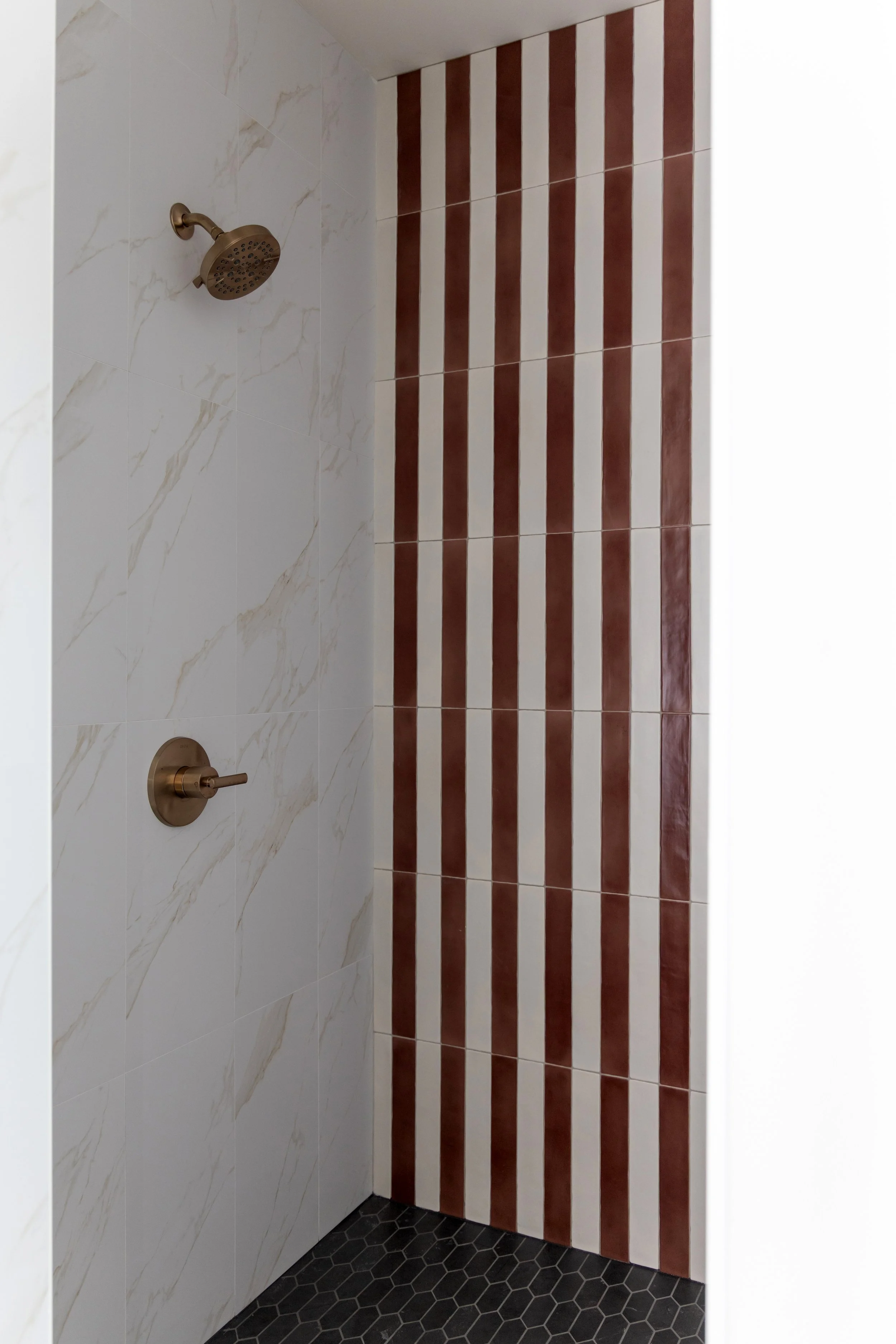 Brown and white striped shower tile