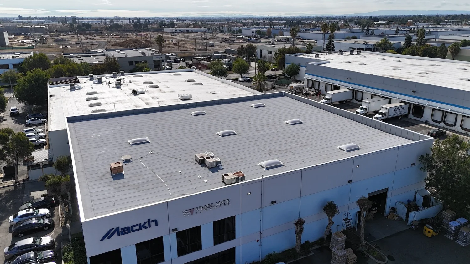 Completed 2-ply flat roof with reflective coating in California