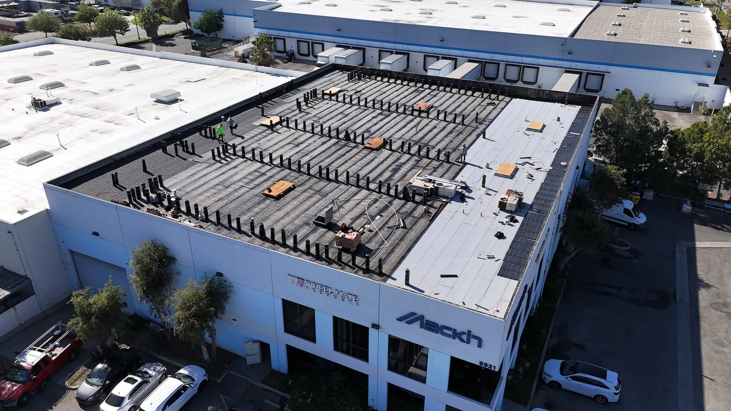 Aerial view of multiple commercial roof systems