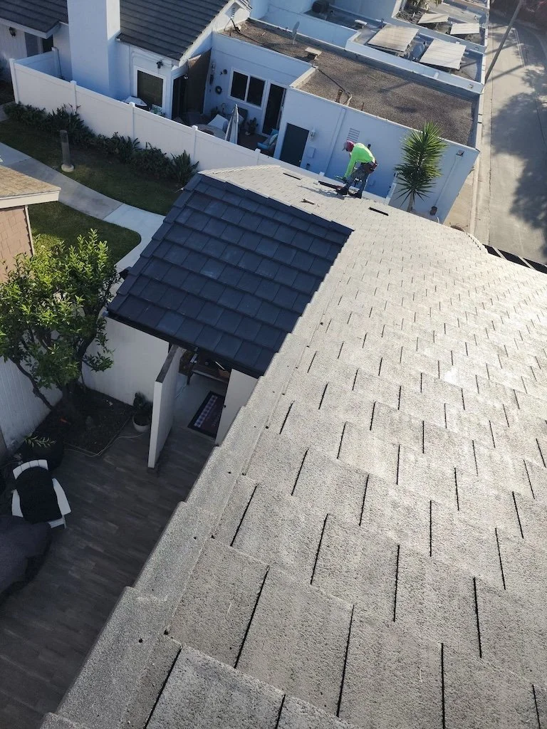New dark gray tile roofing system installation in Long Beach, California.