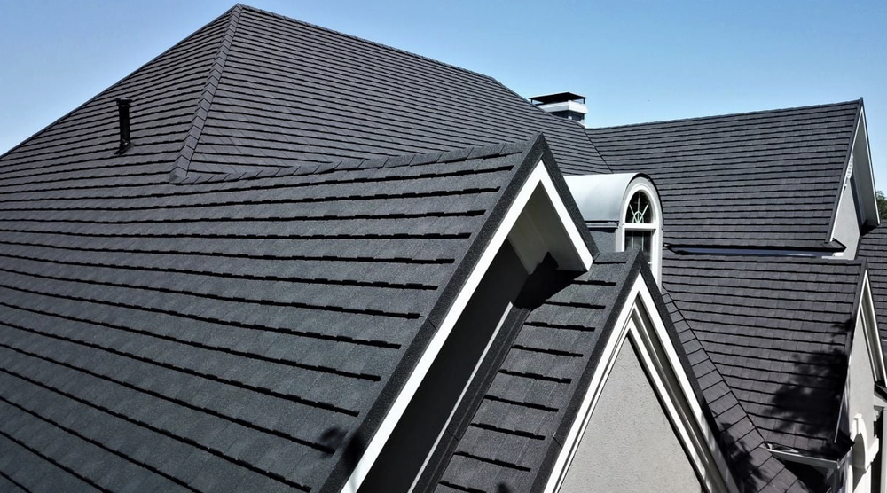 Metal roof in dark gray with a steep pitched roof.
