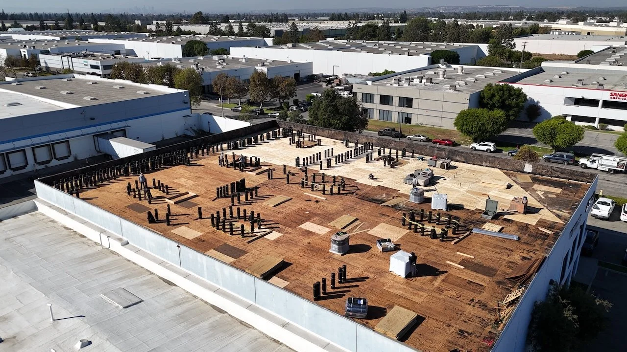 Aerial view of commercial flat roof under installation in Santa Fe Springs