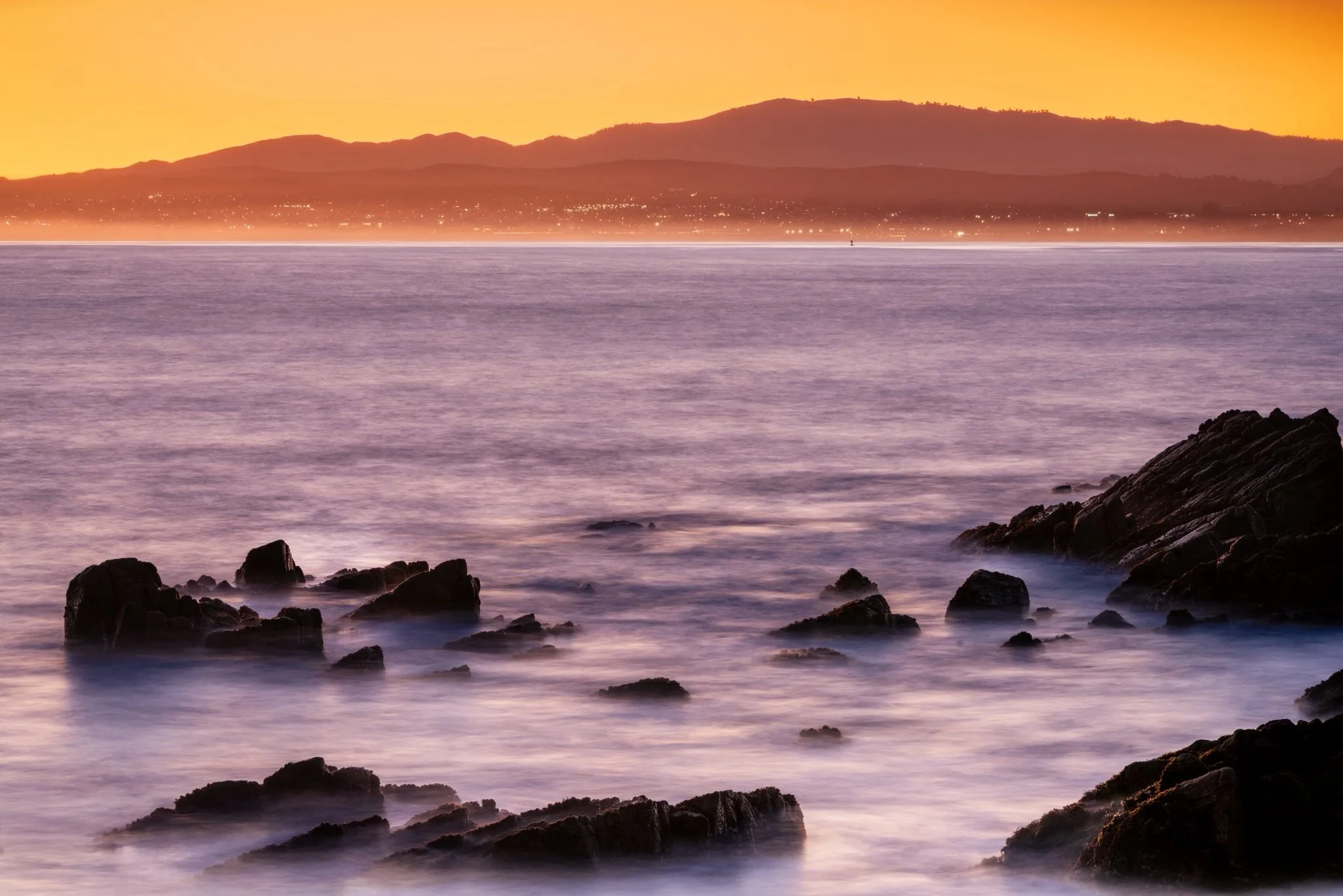 I&rsquo;ve been noticing how often I&rsquo;m drawn to the places where the city and nature overlap &mdash; streetlights floating in fog, ocean water holding reflections of city lights, a whale rising while smokestacks sit quietly in the distance.

I 