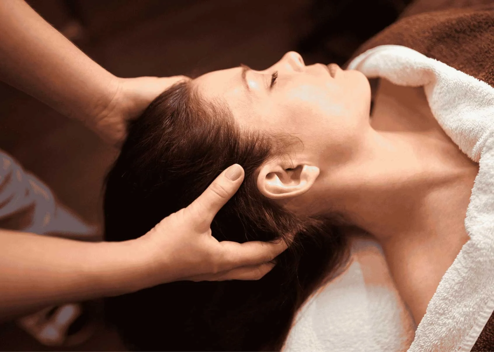 Gentle massage for migraine relief using calming techniques to reduce headache frequency, relieve head and neck tension, and support nervous system balance.
