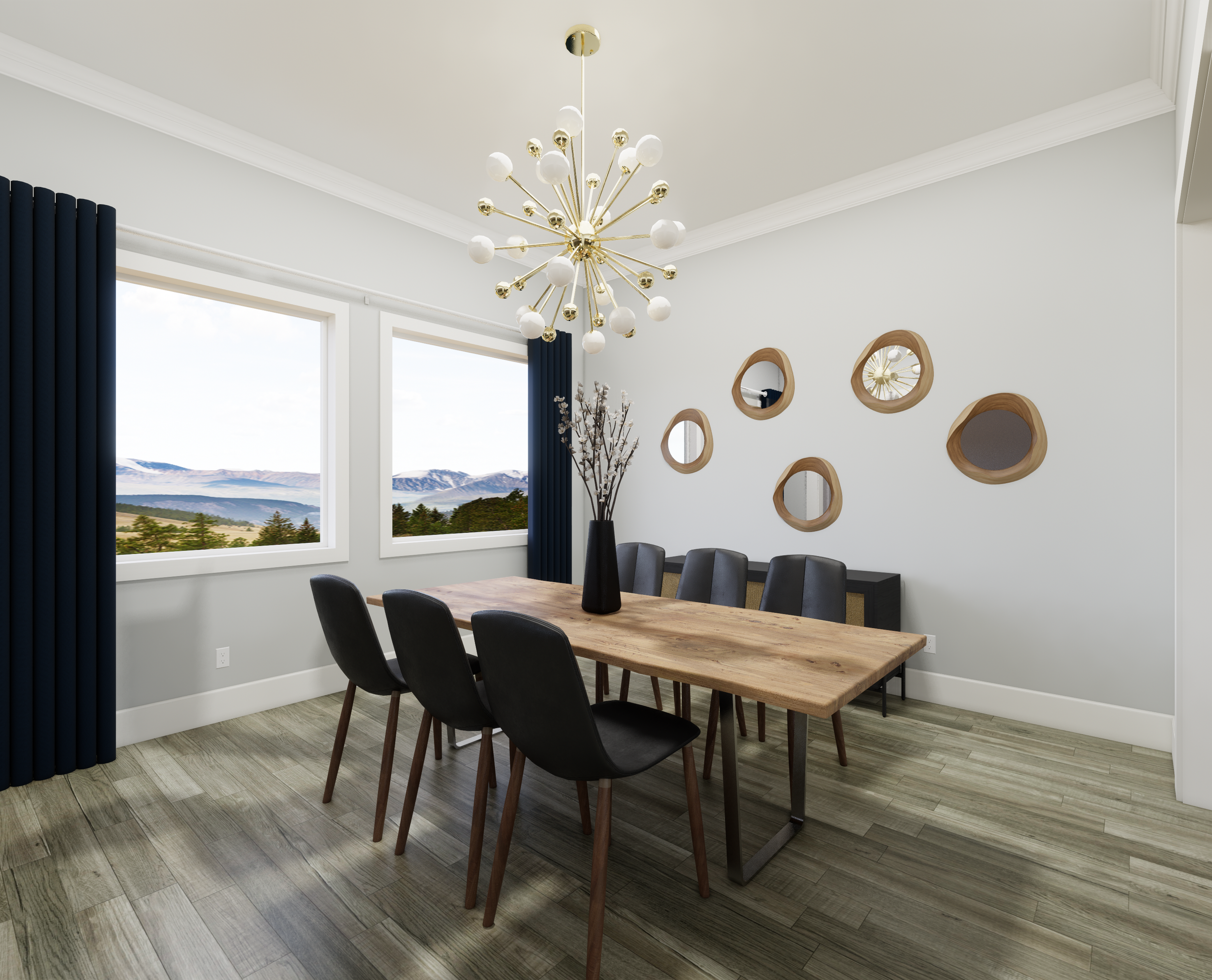 A modern dining room featuring a natural wood table paired with sleek black chairs. The large windows frame scenic views, bringing in natural light. A bold chandelier and organic-shaped mirrors add visual interest and balance, creating a warm yet con