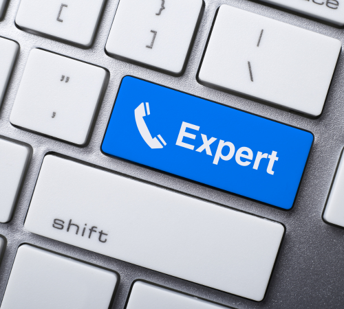 Computer keyboard with a blue key labeled 'Expert' and a phone icon.