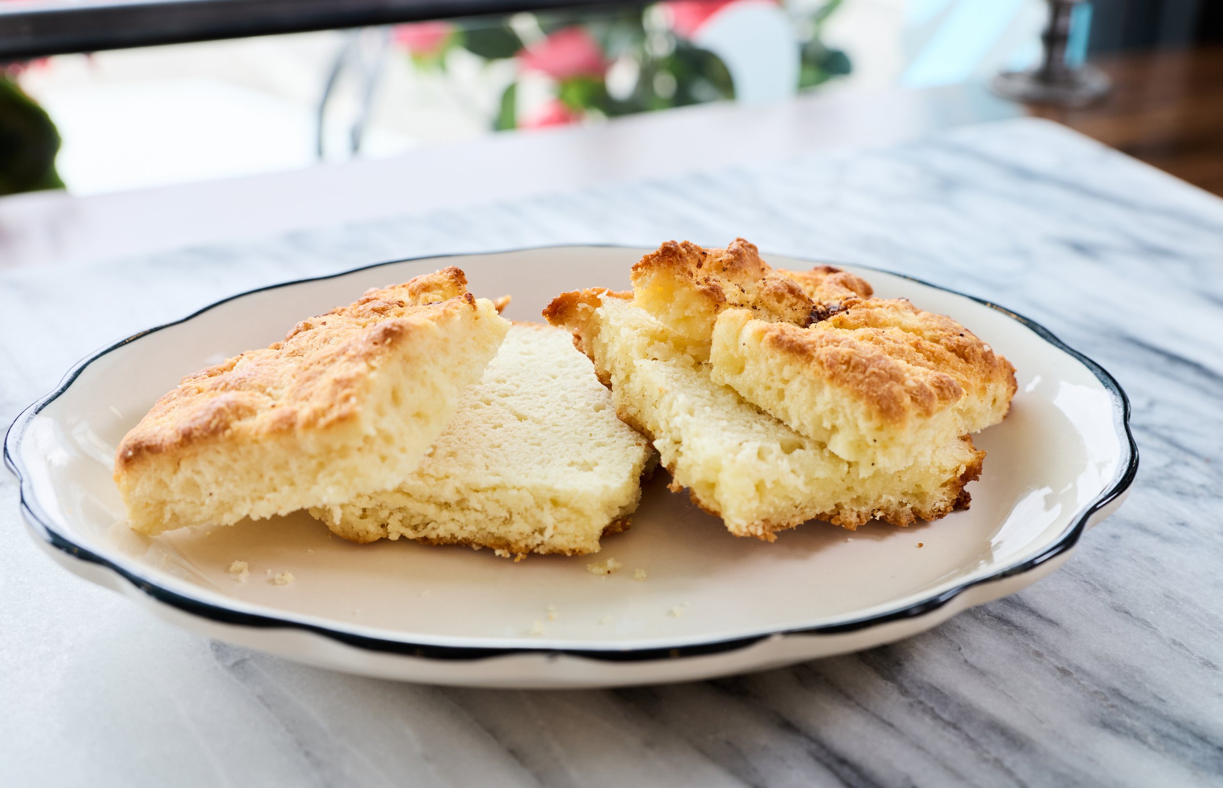 Close-up of house-made biscuits, split open.
