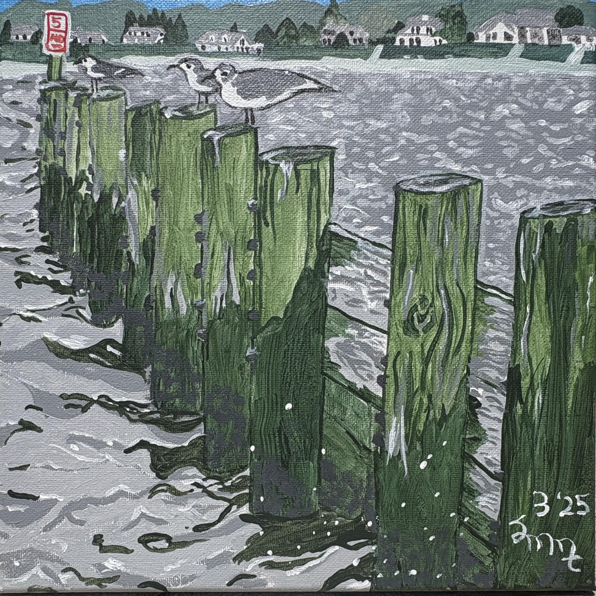 Several Seagulls sitting on the pilings at Southold New York at Founders Landing