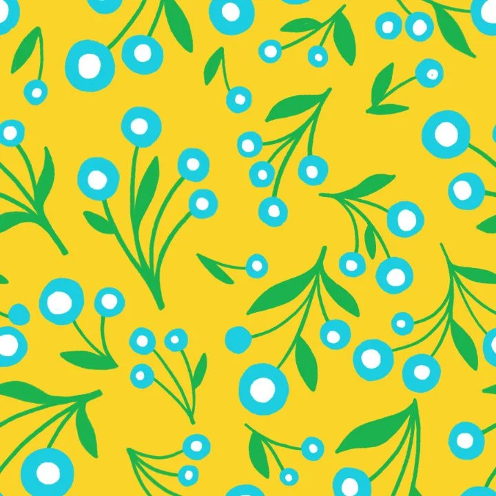 Pattern of blue berries with green leaves on a yellow background.