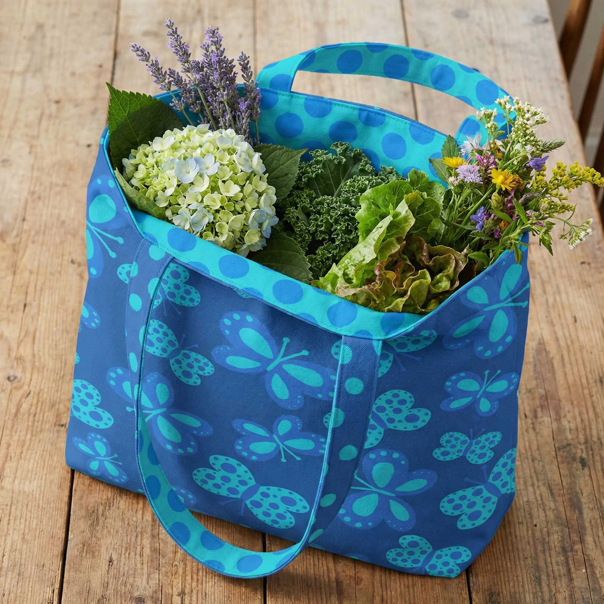 blue butterfly patterned tote bag with interior lining of aqua polka dots filled iwth flowers