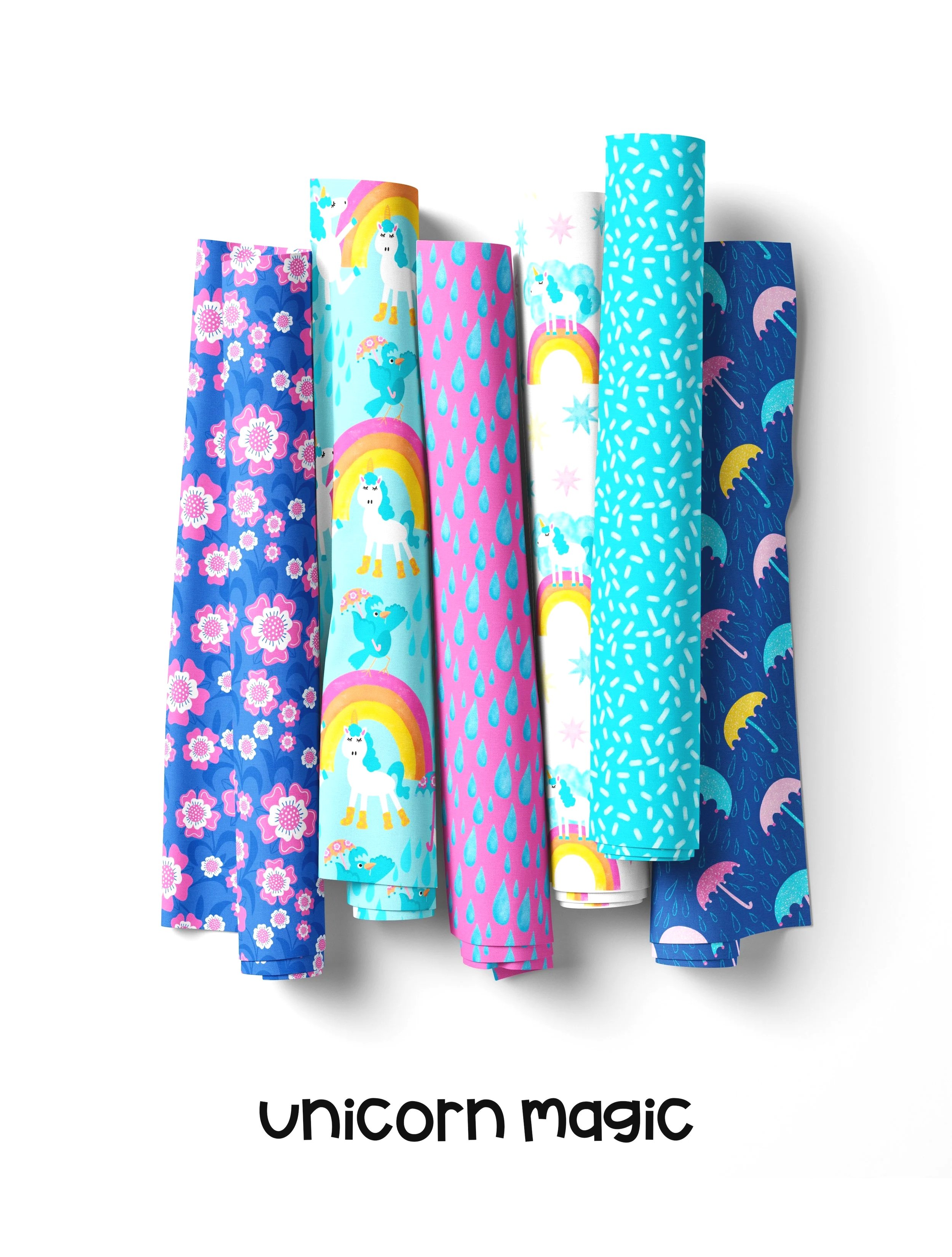 Unicorn Magic fabric collection with unicorns, rainbows, raindrops, and floral patterns. color palette is bright pastel colors
