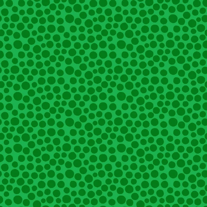 Green background with a pattern of darker green polka dots of varying sizes.