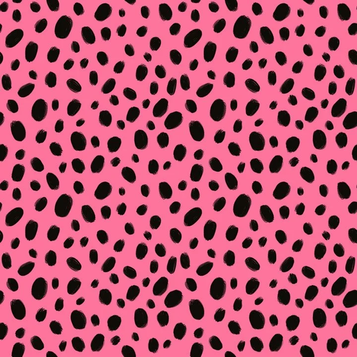 Playful seed-inspired dot pattern with scattered black organic shapes on a pink background, referencing watermelon seeds in a fun, textural coordinating fabric. also available as licensed art for home, gifting, stationary and party goods brands
