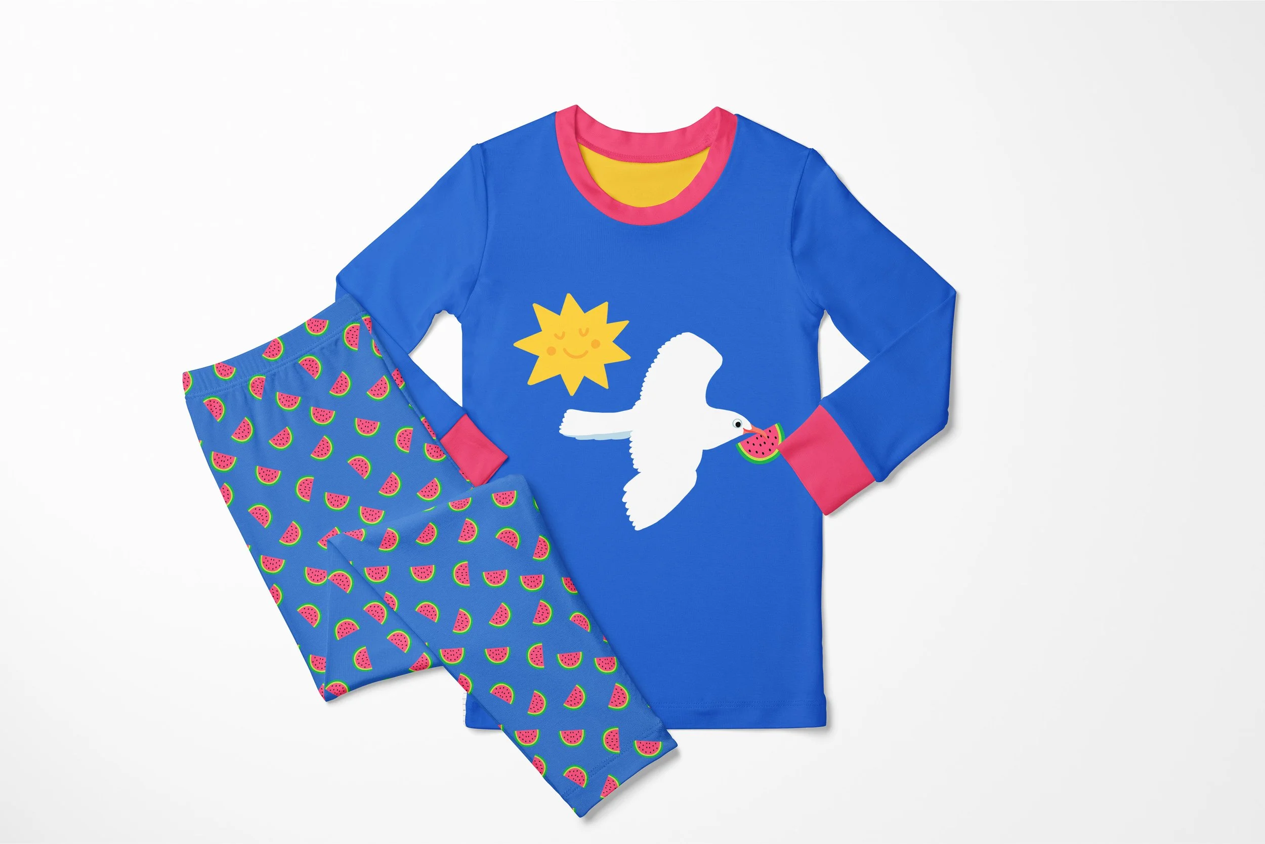 bright blue childrens pajamas featuring happy fun whimsical seagull flying with watermelon and a whimsical yellow sun with a happy face. patterned pajama pants have playful, happy walrus and seagull pattern at the coastline. art available for art lic