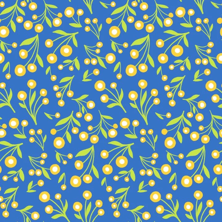 Pattern of yellow berries and green leaves on a blue background.