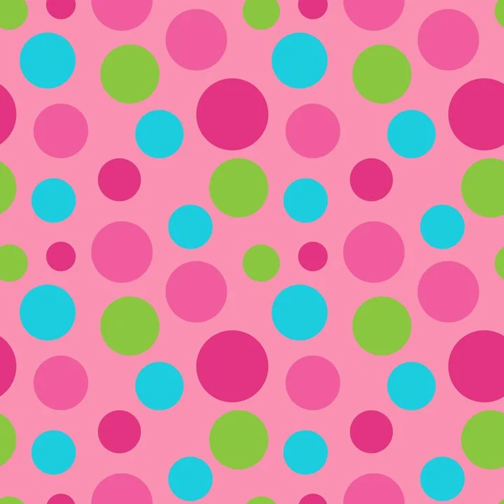 Playful polka dot fabric pattern with colorful dots on a pink background, designed as a fun coordinating print for children’s apparel and quilting.