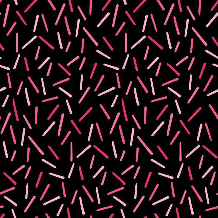 Pattern of pink and red sprinkles on a black background