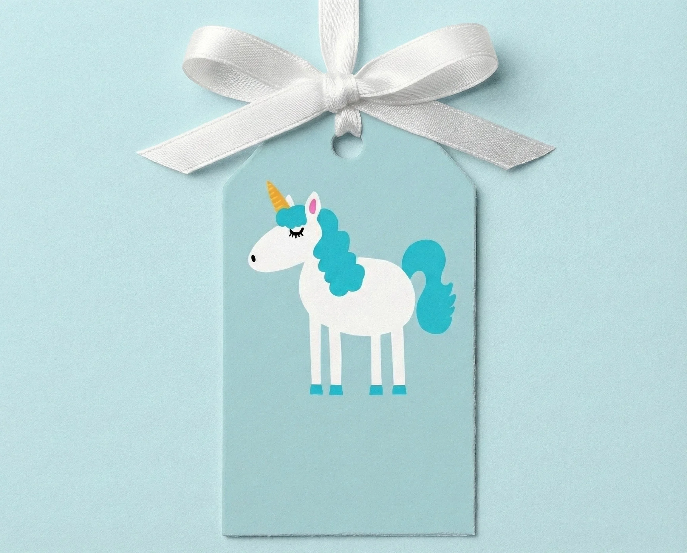 Unicorn gift tag featuring a playful unicorn illustration on a light blue background
