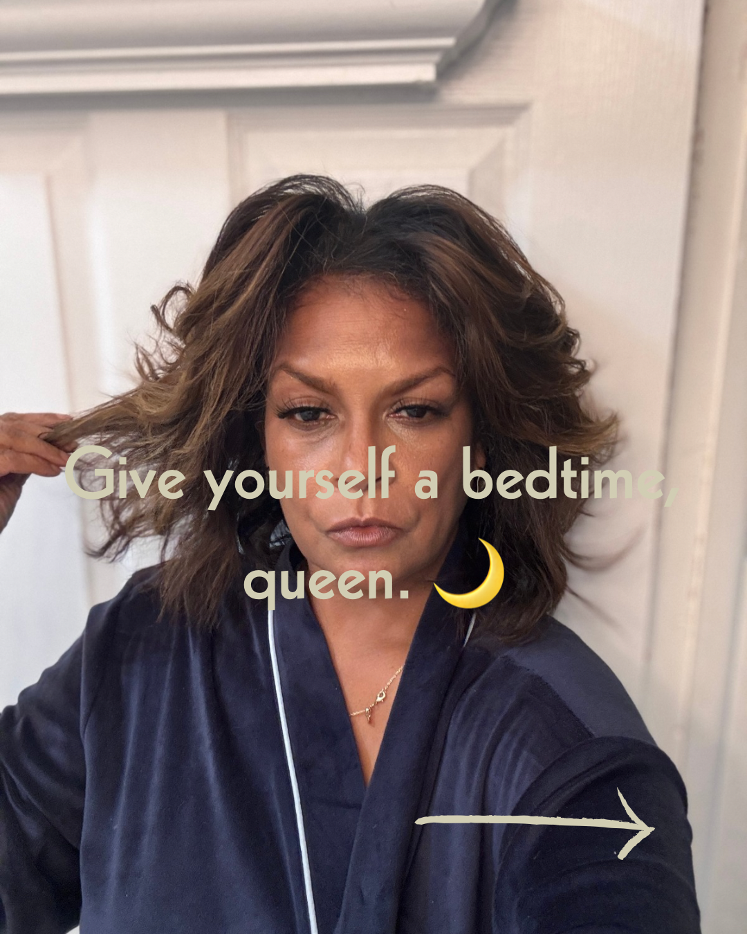 Keenya Willis in a navy robe with voluminous hair against a white door with text overlay reading Give yourself a bedtime  queen representing intentional sleep as self care and restoration