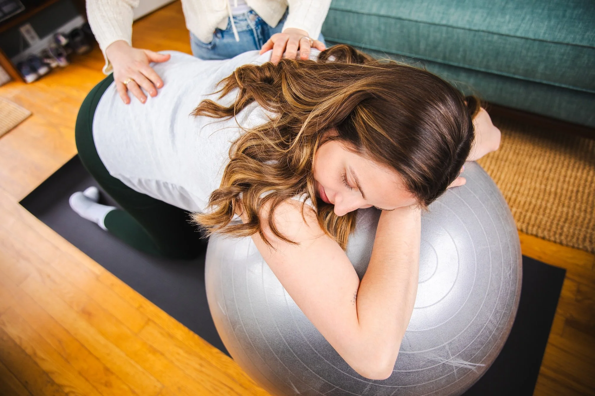 birthing woman being helped by a doula
