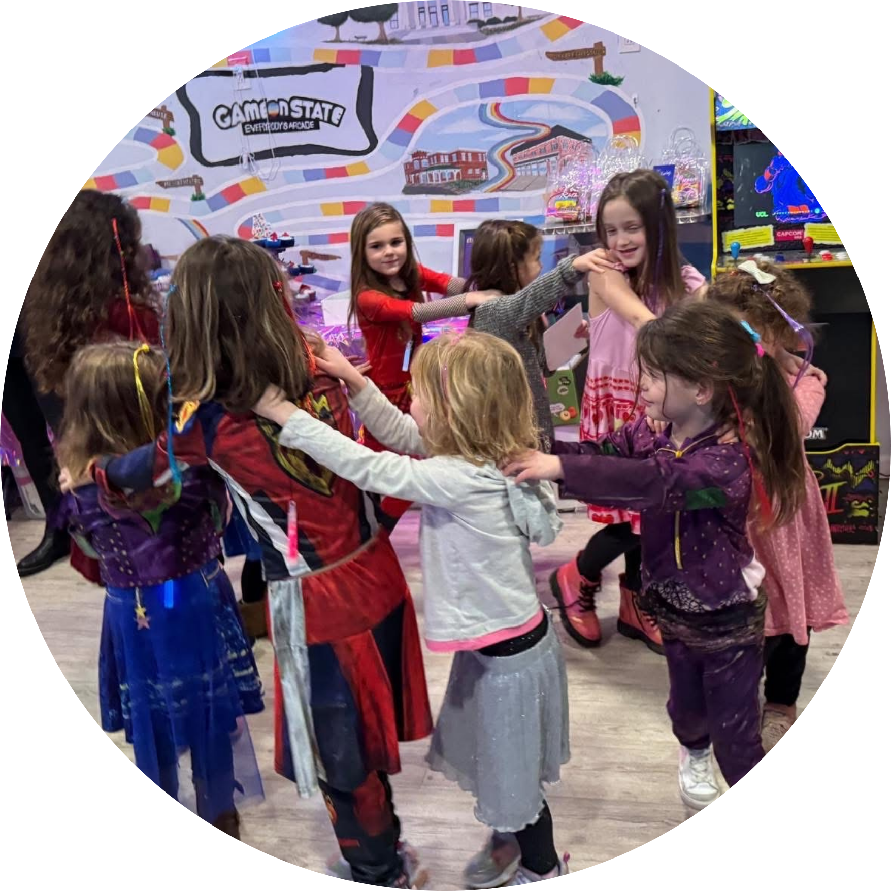 parents night out Media PA, Group of children at an arcade or game center, playing and interacting with each other, with arcade games and a colorful background behind them.