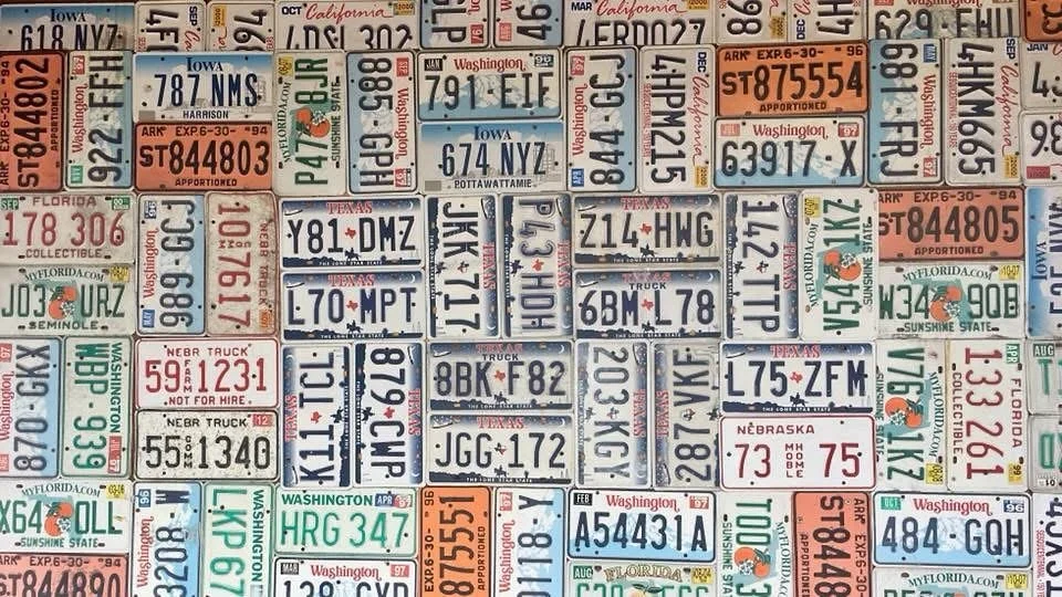 Can you guess where this is? How many states can you find?

A wall stitched together from America&rsquo;s highways&mdash;every plate once carried a journey, now pieced into a mural of stories. 🌎

Photo by #MotoMoJo

#RoadLore #WhereIsThis