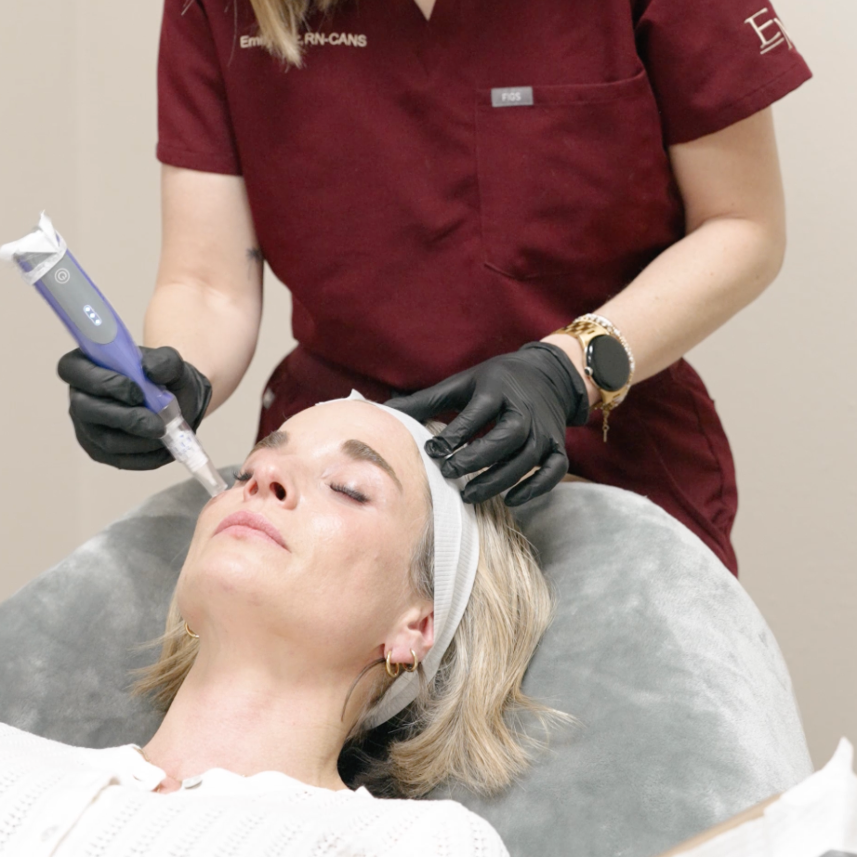 Person receiving facial treatment with SkinPen shown, wearing gloves and headband.