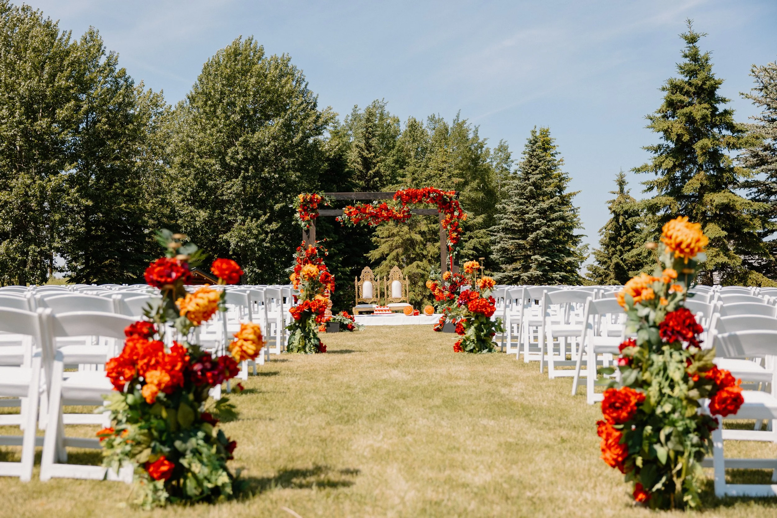 outdoor-wedding-ceremony-aisle-floral-arch-garden-venue.jpg