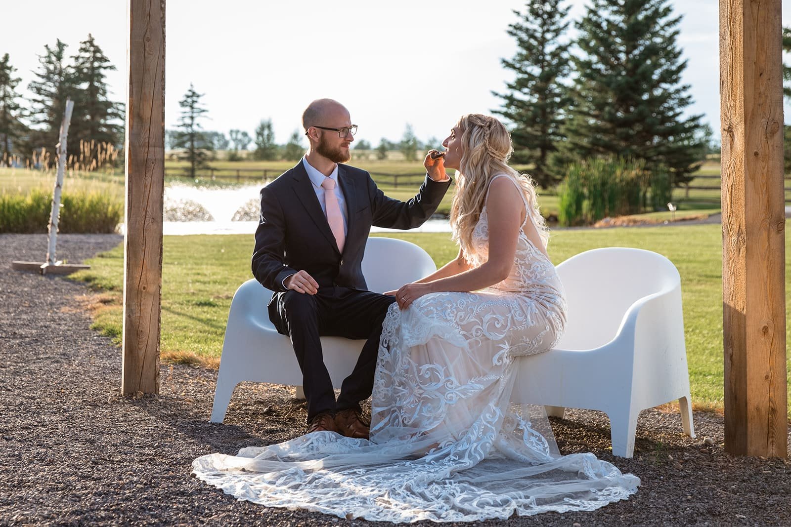 pine-and-pond-wedding-couple-seated-pond-view.jpg