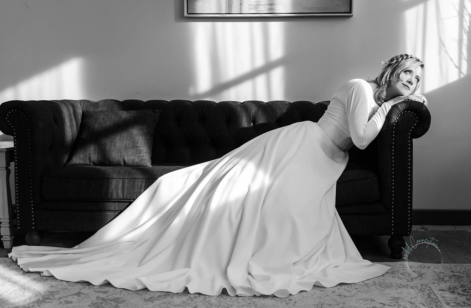 Bride relaxing in the Pine and Pond bridal suite before her outdoor wedding ceremony in Alberta