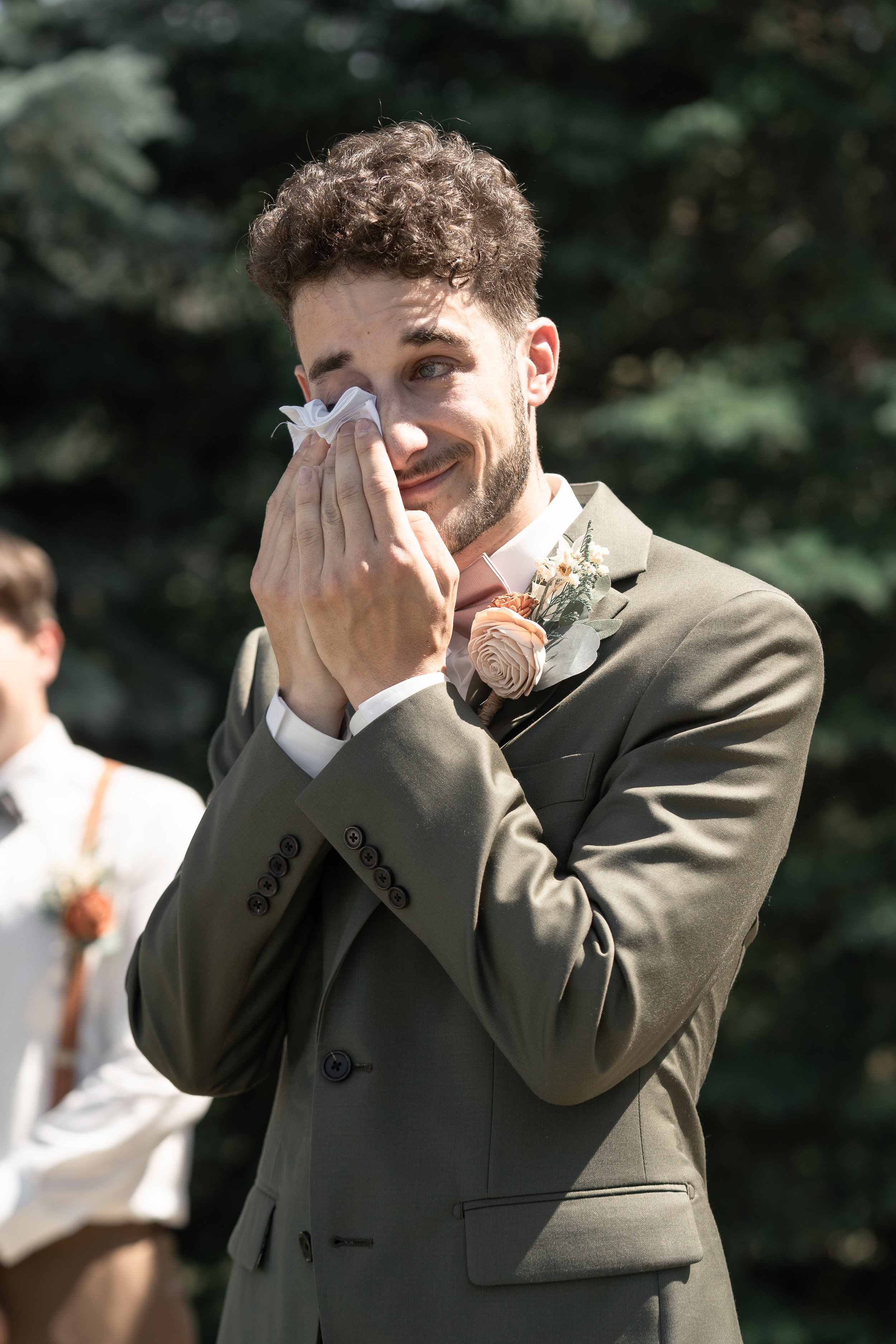 emotional-groom-wedding-ceremony-outdoor-venue-central-alberta.jpg