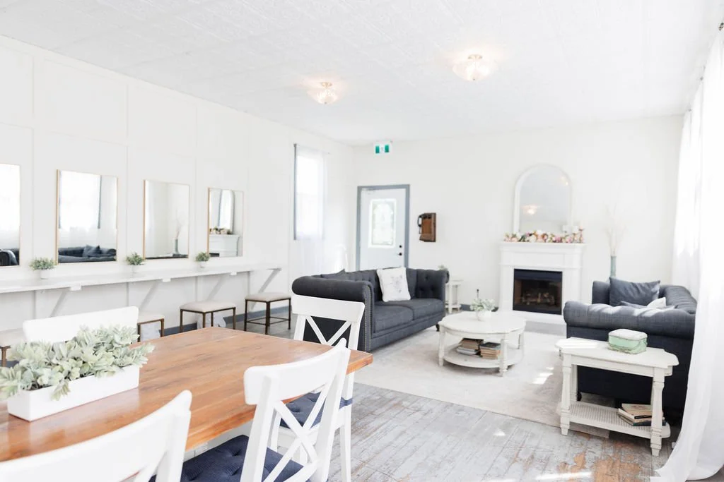 Bright and airy getting-ready room at Pine and Pond Wedding Venue showcasing vintage-inspired décor, soft seating, and large windows — perfect for relaxing and preparing before the ceremony.
