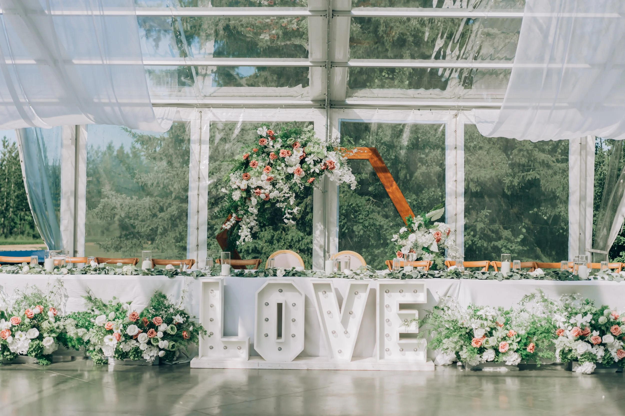 Love-Sign-Clear-Tent-decorated-with-flowers-Pine-and-Pond-wedding-venue.jpg
