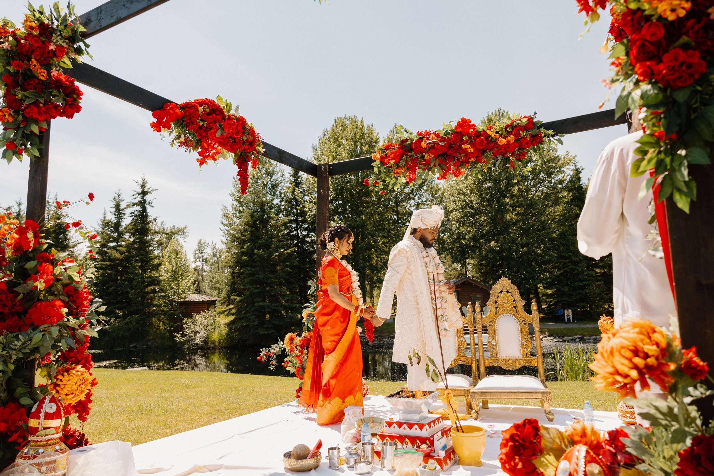 hindu-wedding-ceremony-floral-mandap-outdoor-venue.jpg