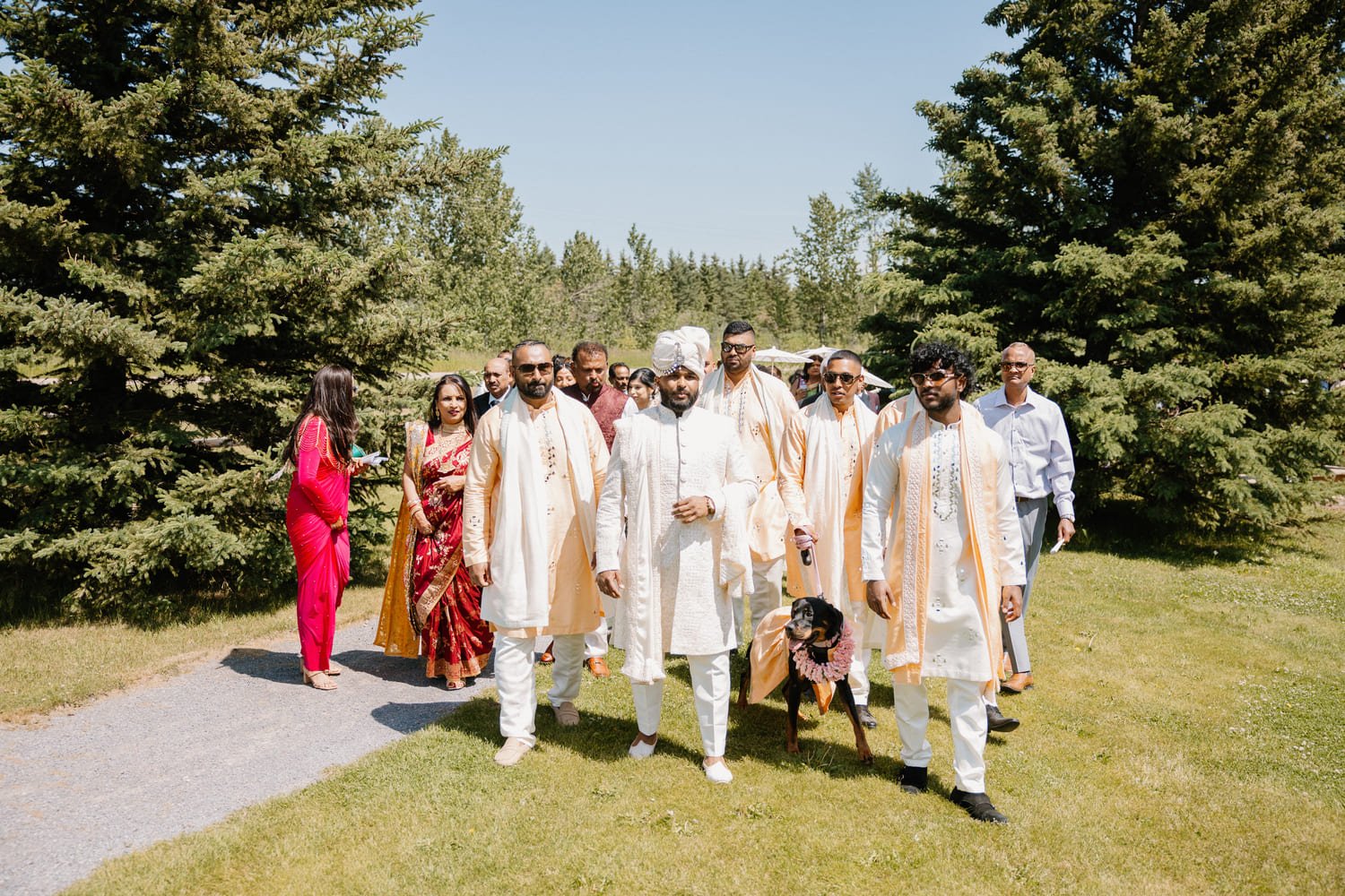 Groom arriving with family during a traditional baraat at Pine and Pond Wedding Venue