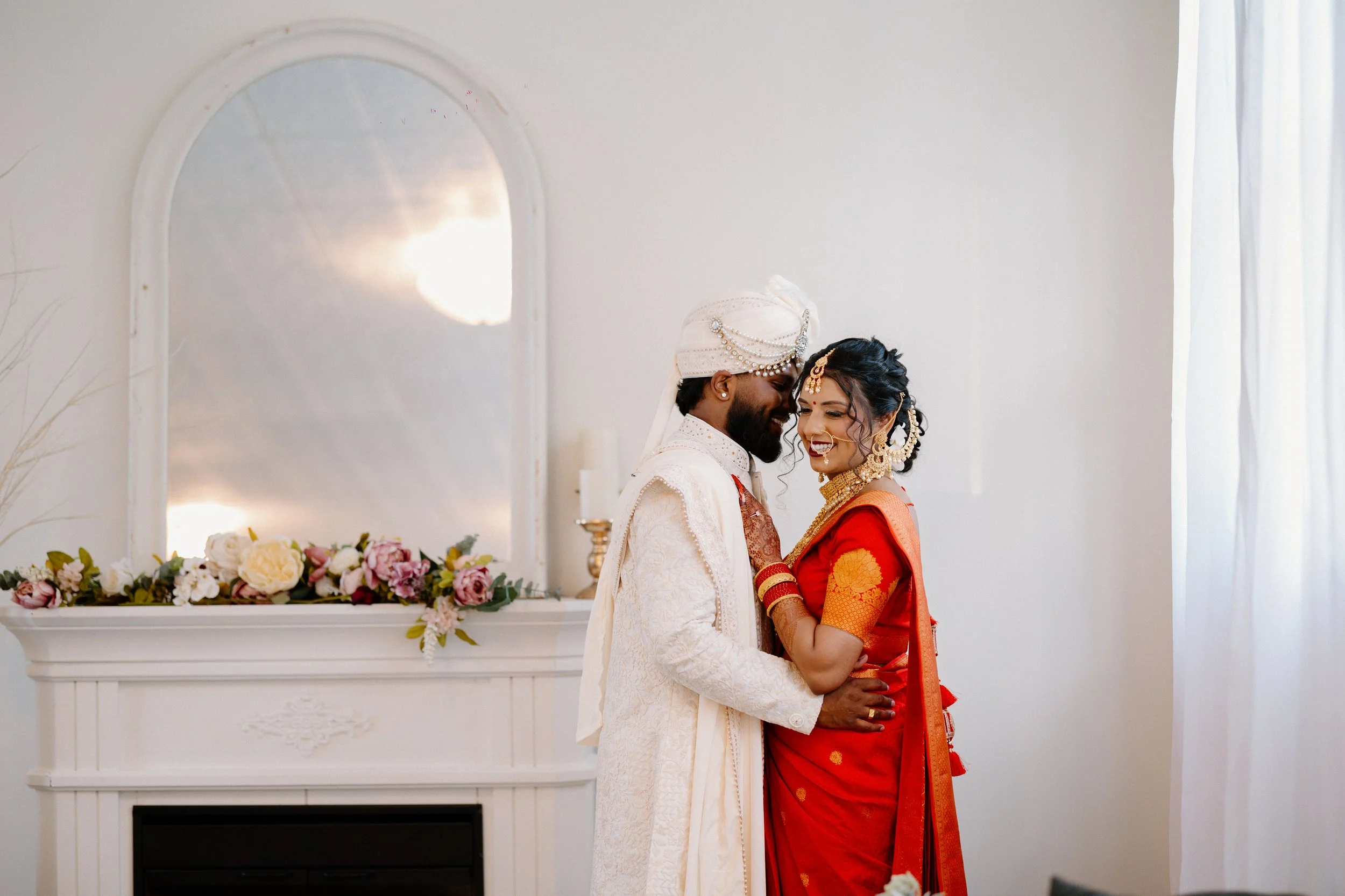 south-asian-wedding-couple-indoor-portrait-elegant-setting.jpg