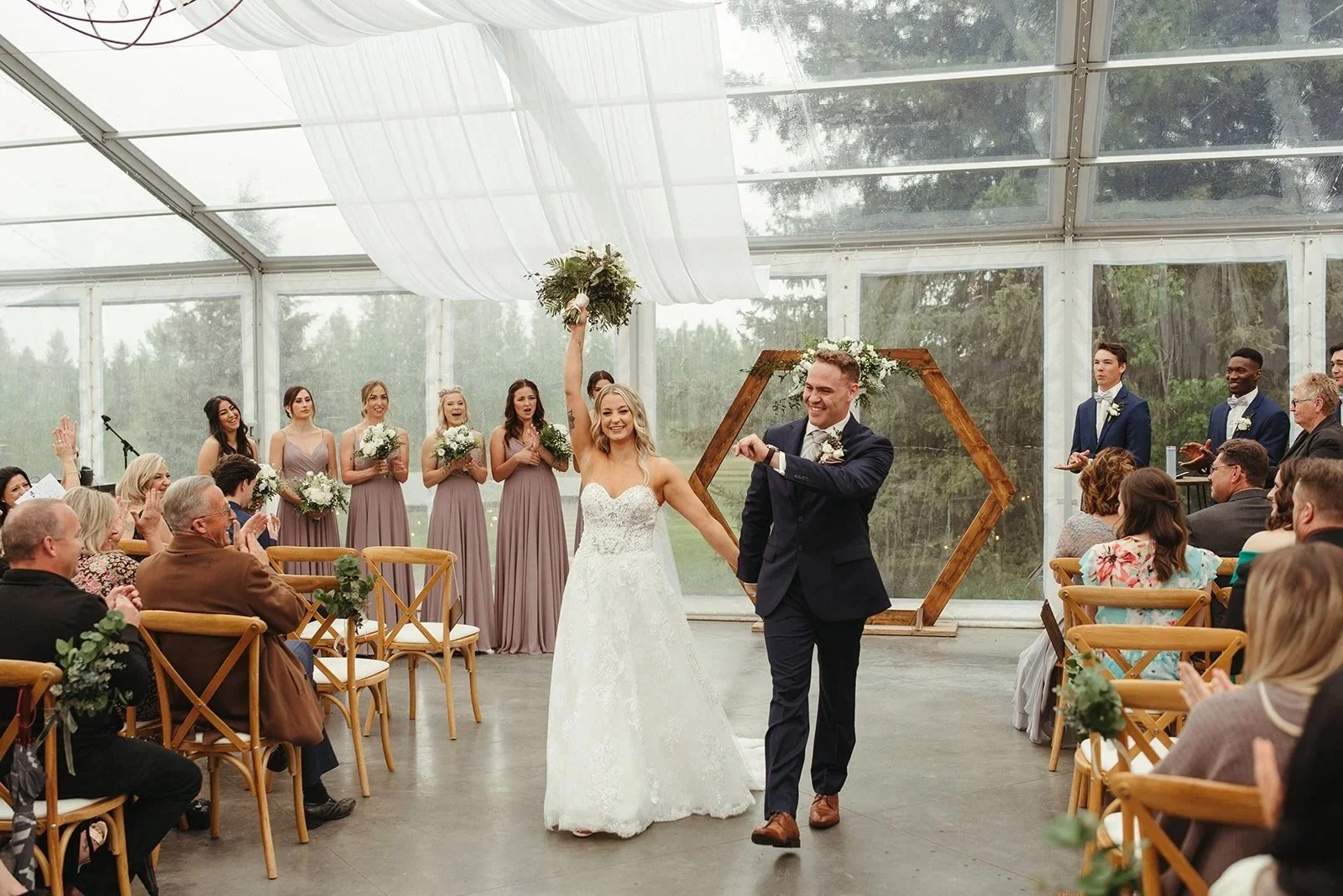 Elegant clear tent wedding reception at Pine and Pond offering weather protection and outdoor views