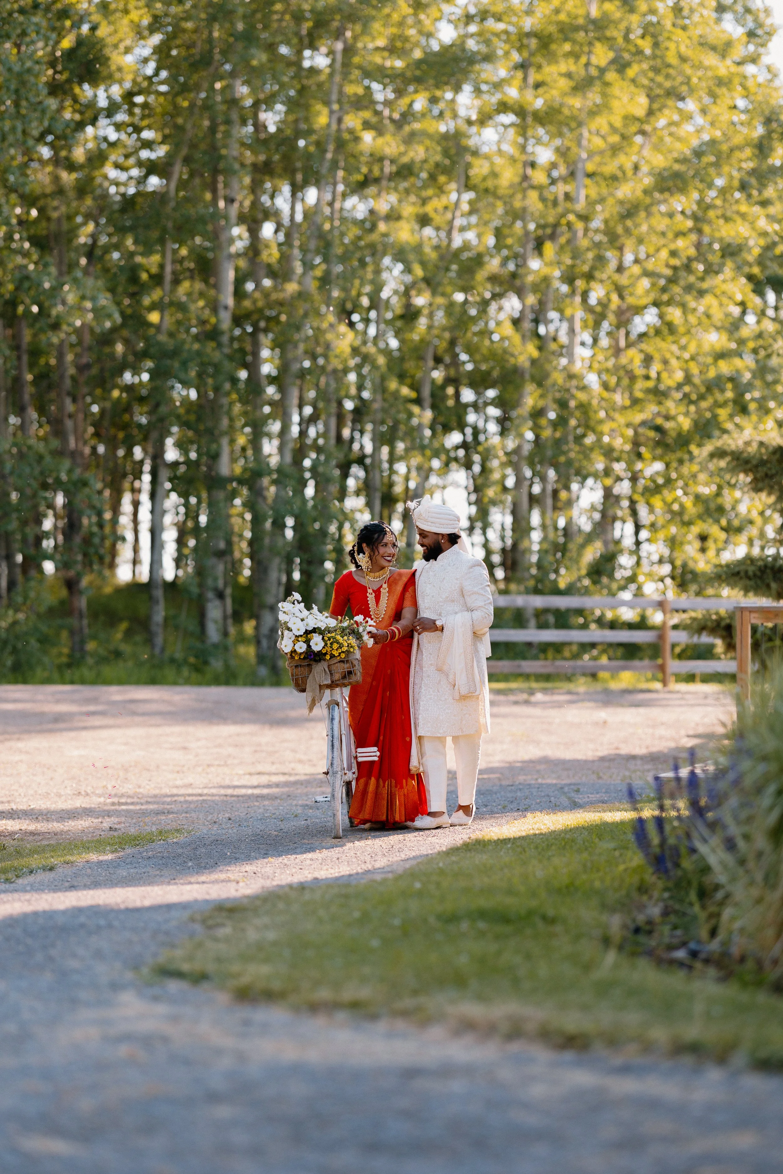 south-asian-wedding-couple-bicycle-romantic-outdoor-venue.jpg