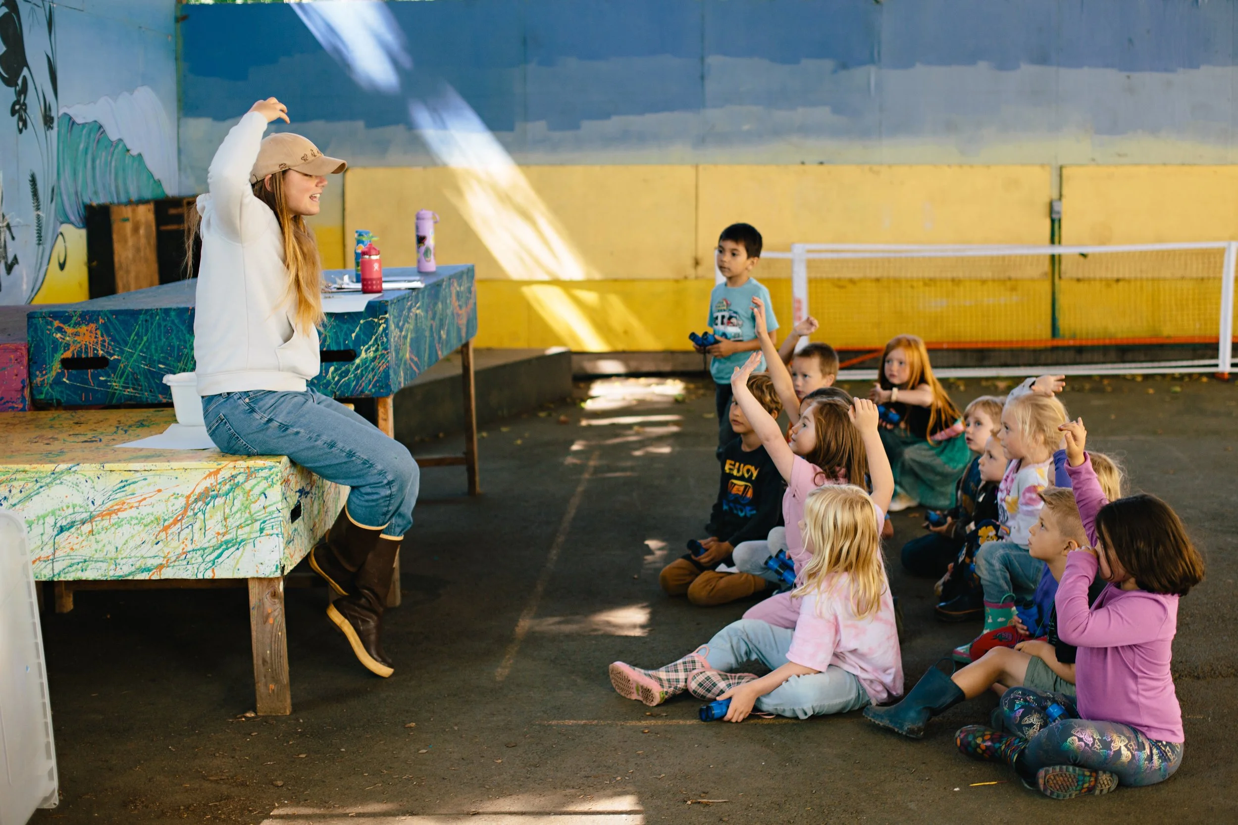 A guest teacher teaching a Neskowin Valley School class about birdwatching.
