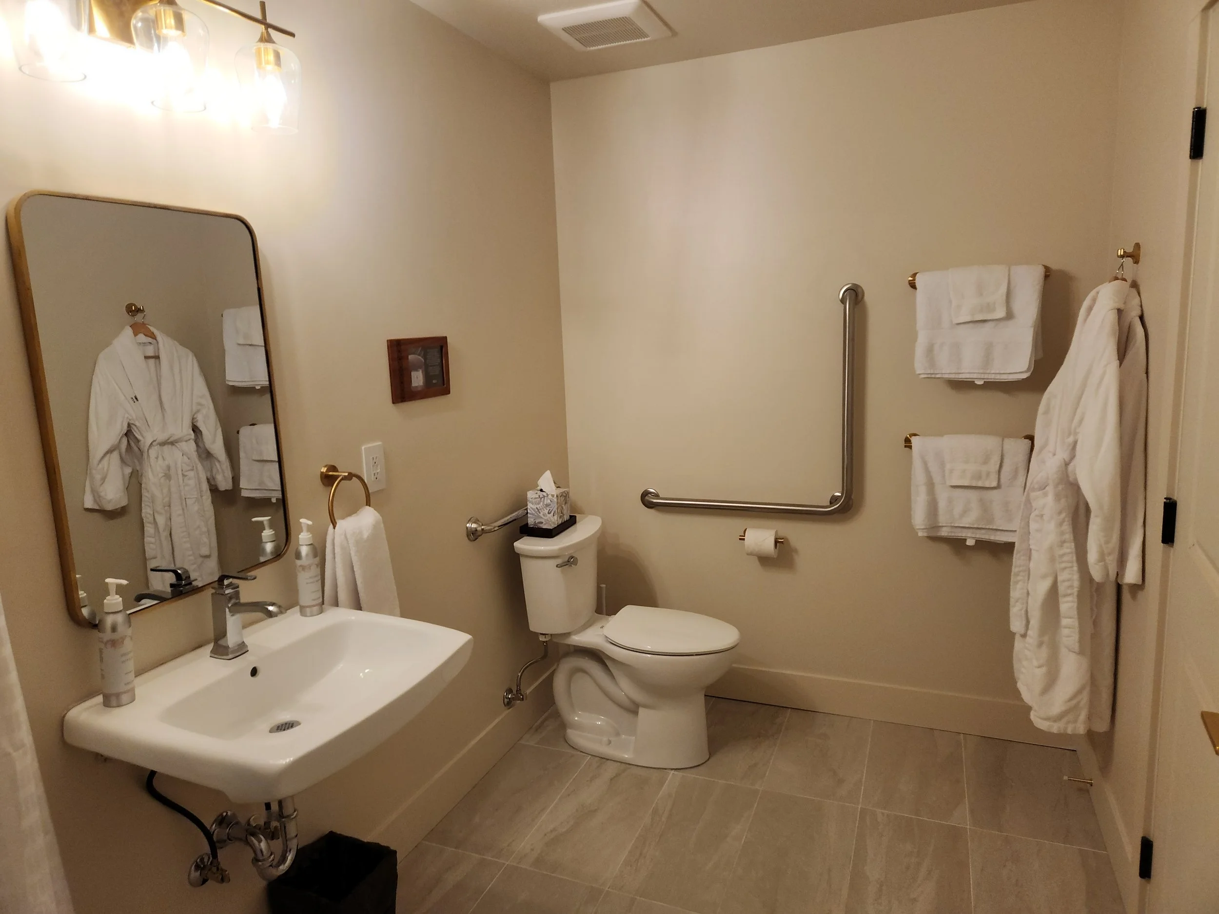 Lots of space to accomodate mobility needs in the ensuite of the accessible room at the King George Hotel, Cumberland, Comox Valley.