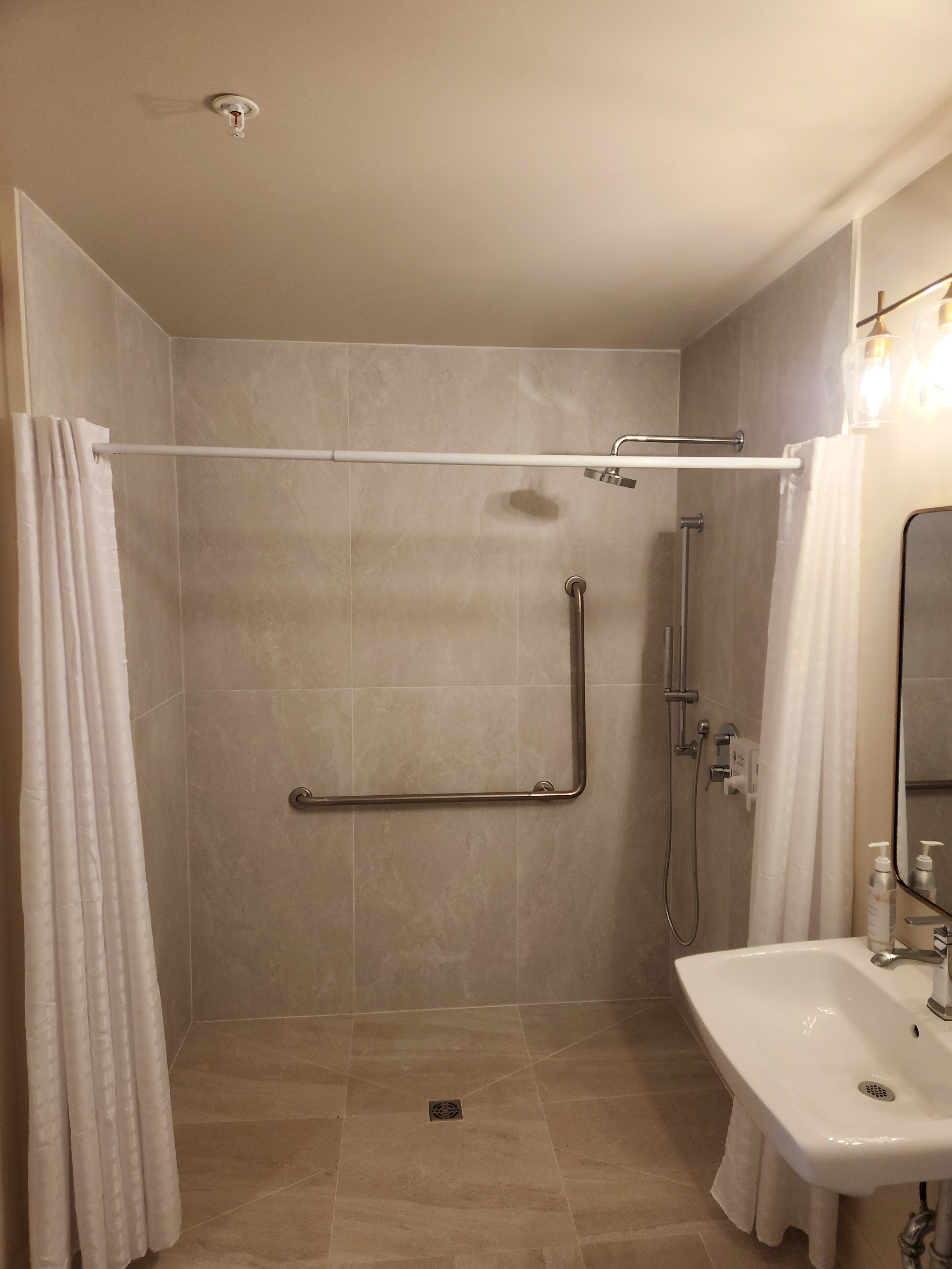 Large walk-in shower in the accessible suite at the King George Hotel, Comox Valley.