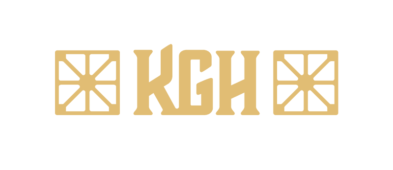 Gold-colored logo with two symmetrical geometric patterns on each side and the letters 'KGH' in the center.