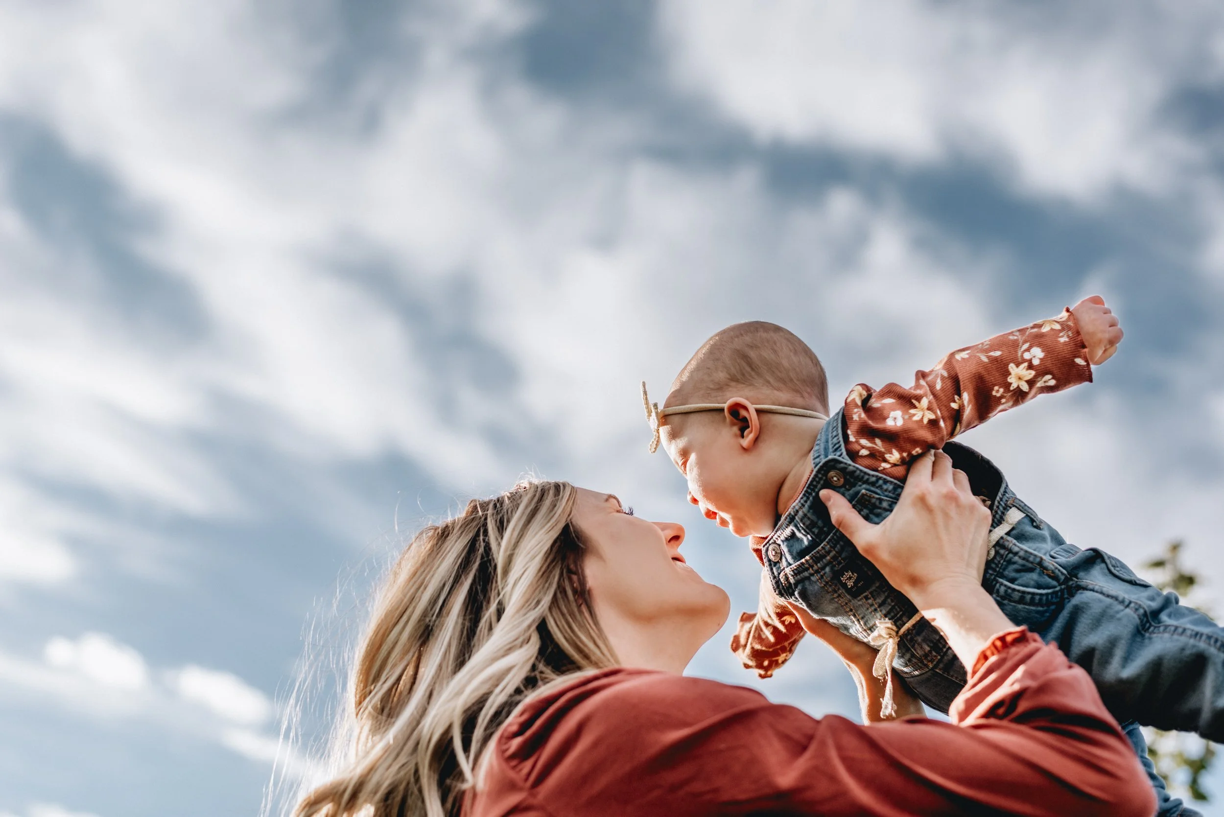 A mom playing airplane with her baby in Kalida, Ohio.