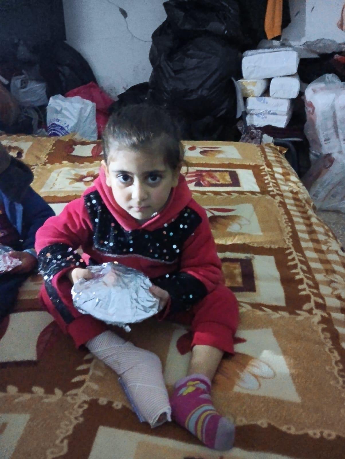 Mayar receiving food aid - Gaza