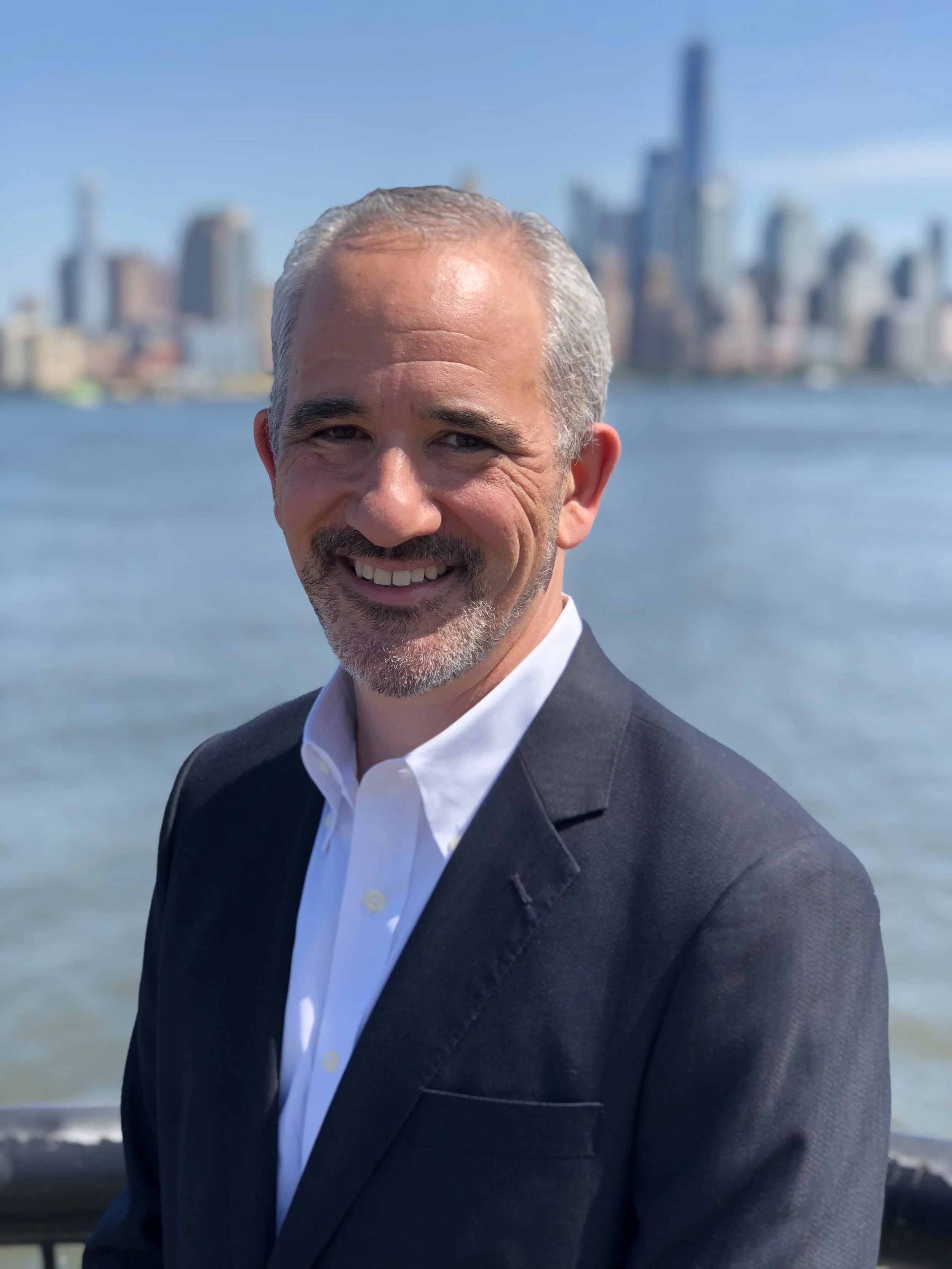 photo of Gordon Haas with view of NYC in background