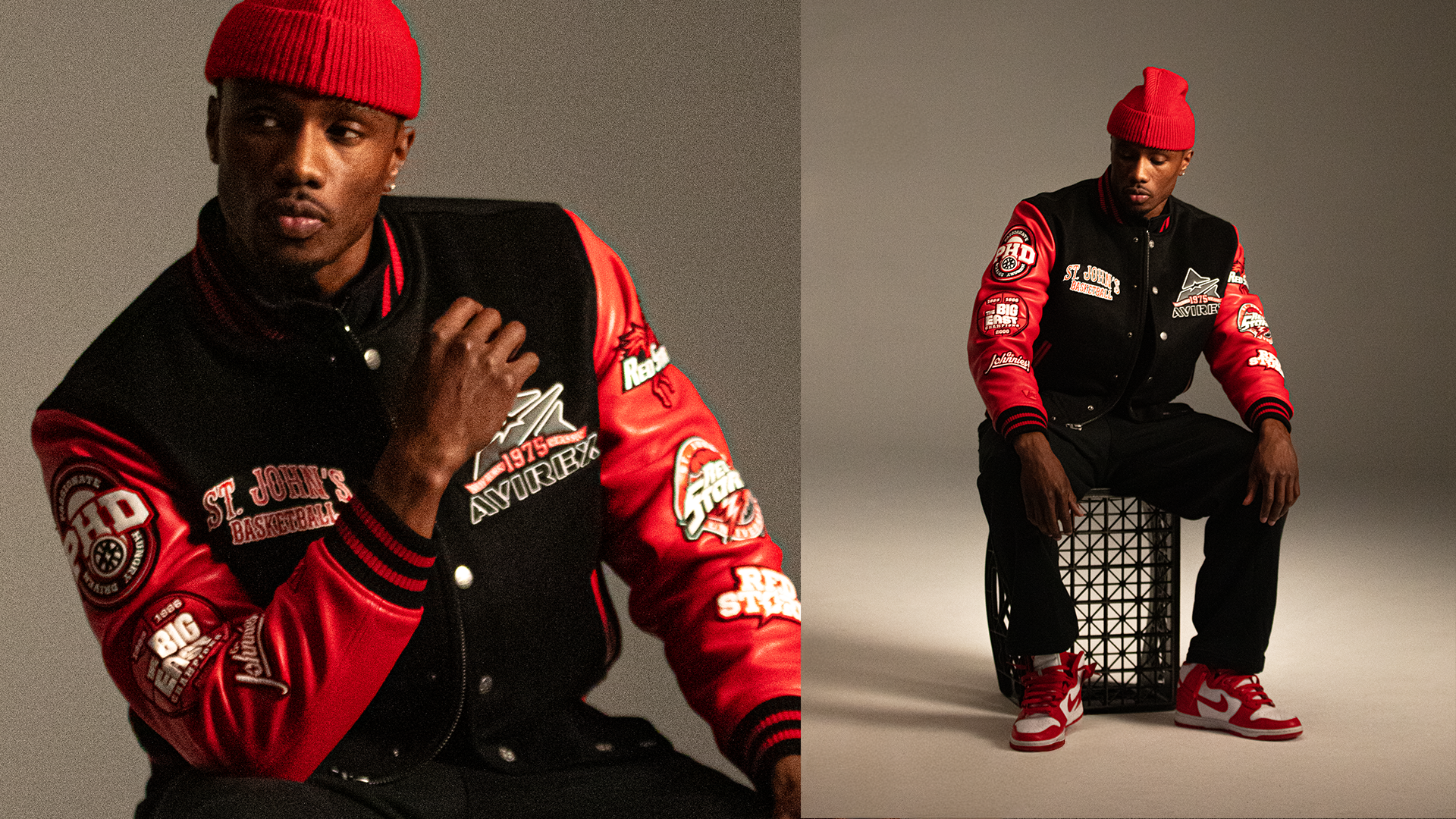 A young man wearing a red beanie, a black and red varsity jacket with patches, black pants, and red and white Nike sneakers, sitting on a black crate in a studio with a neutral background.