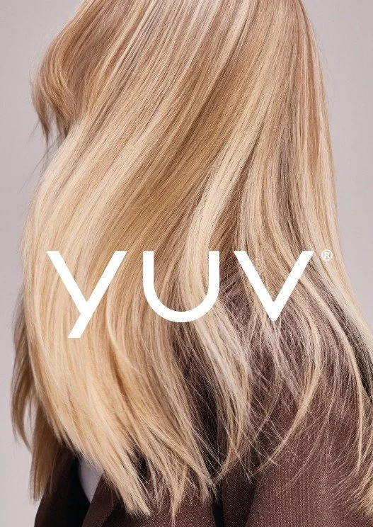 Close-up of blonde hair with the word 'YUV' overlaid in white text.