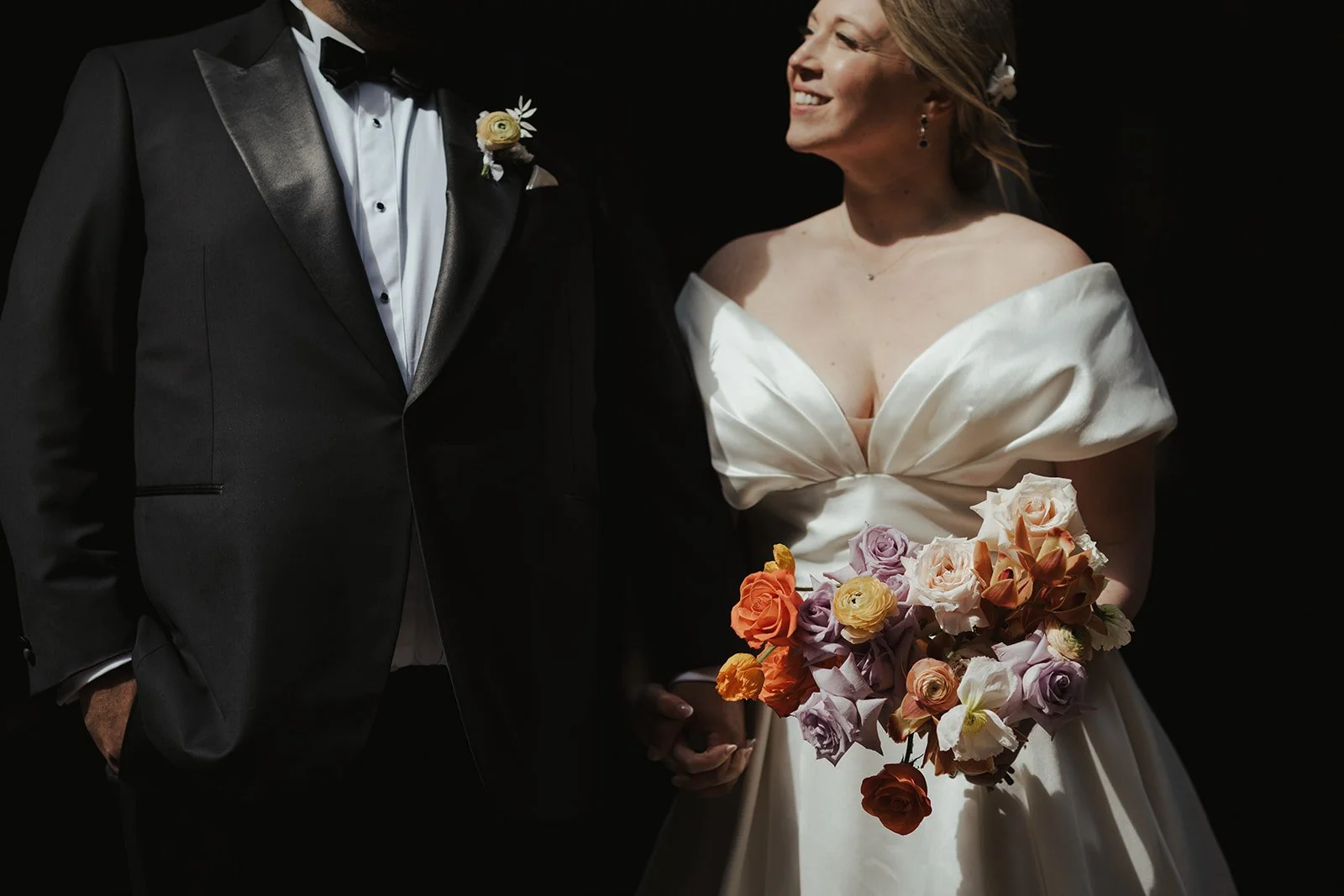 Bride and groom holding hands for bespoke Whistler wedding