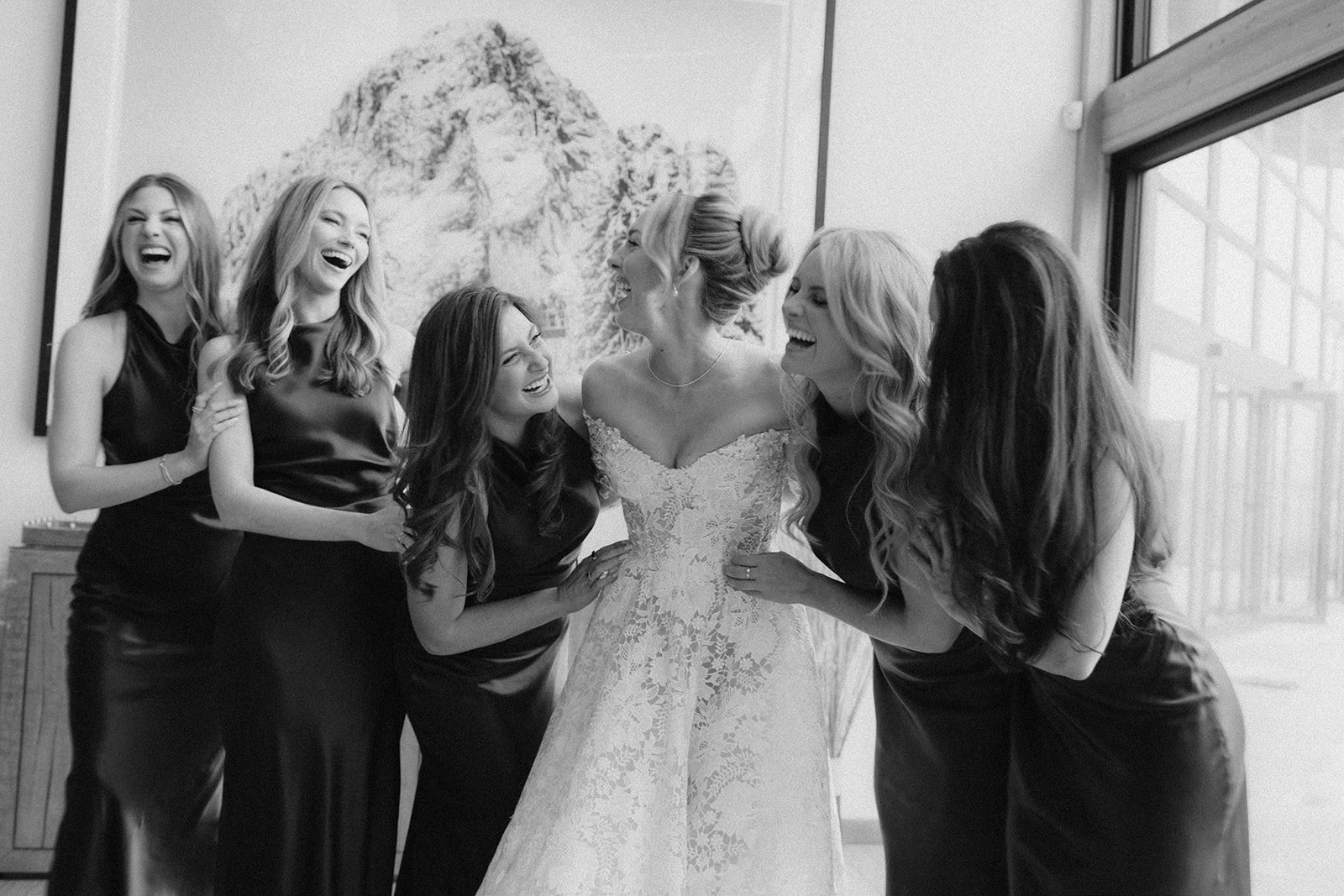 Bride getting ready with her bridesmaids before her Whistler wedding, planned and designed by Bliss.